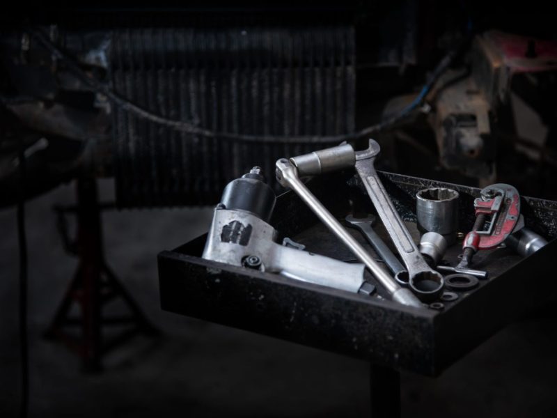 Tools for repairing many cars that are placed on the tool tray Tools for repairing many cars that are placed on the tool tray, mechanical tools. Professional mechanic using different tools for working in auto repair service